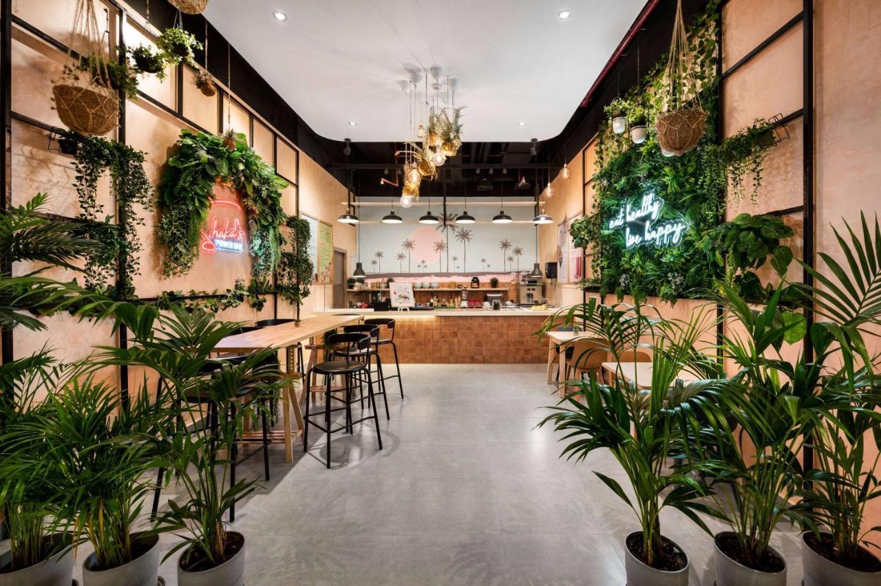 윈덤 도하 웨스트 베이 호텔 외부 사진 The interior of a Starbucks Reserve store in Shanghai, China