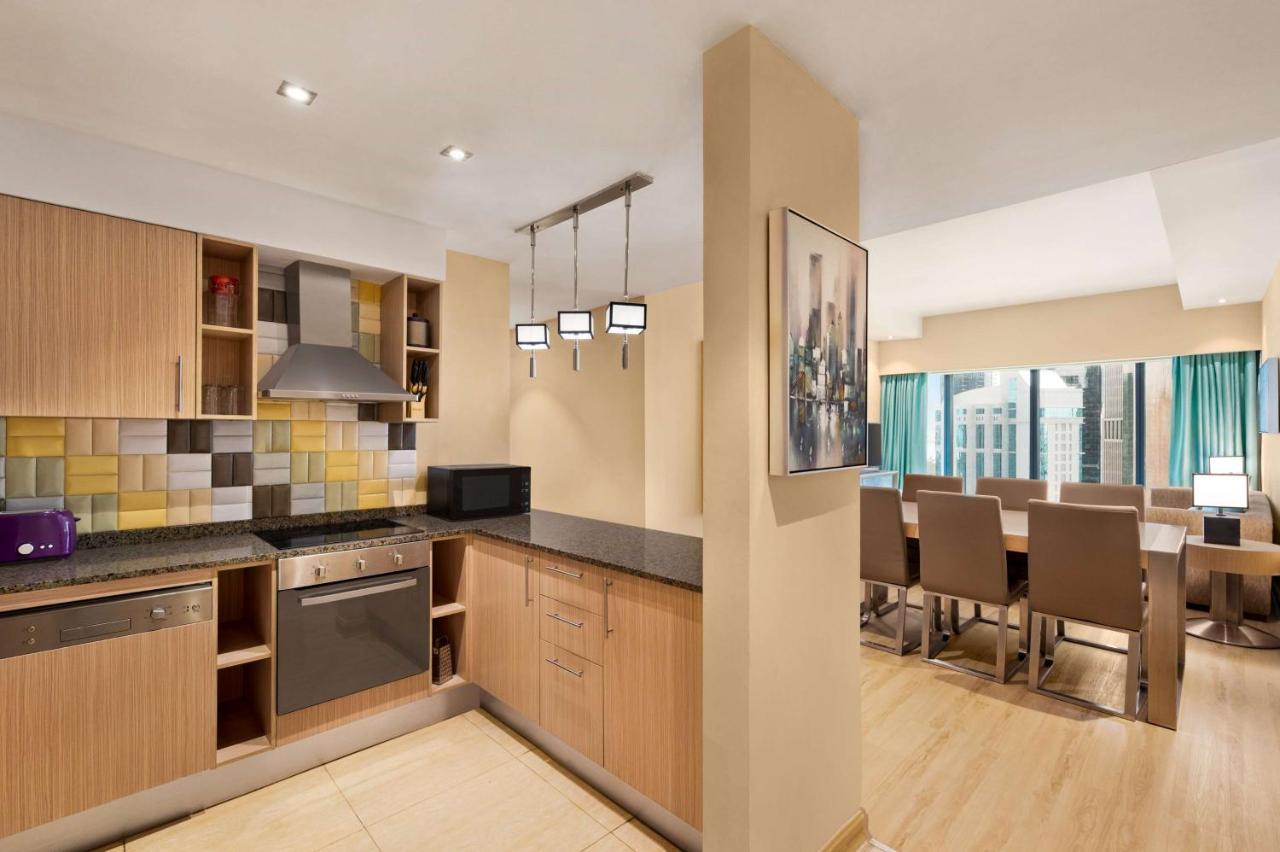 윈덤 도하 웨스트 베이 호텔 외부 사진 A typical apartment interior